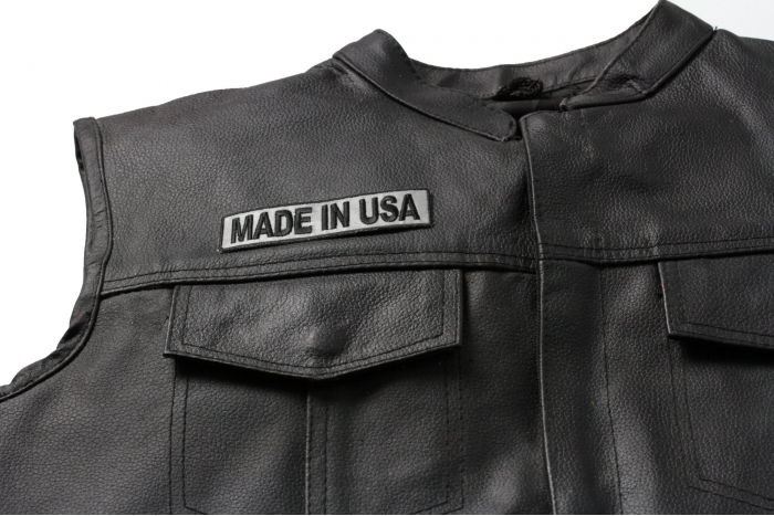 Made In USA Small Reflective Patch - 4x1 inch. Embroidered Iron on Patch shown on leather vest