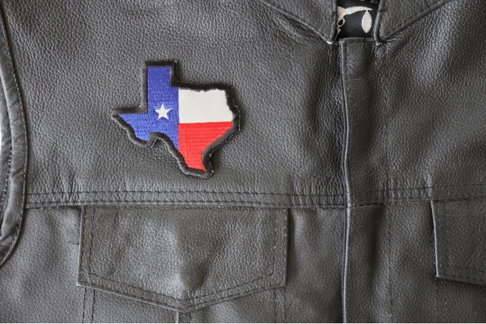 Reflective Texas Map Flag Patch - 3x2 inch - Embroidered Iron on Patch shown on leather vest