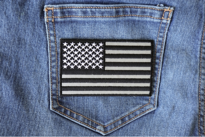 American Flag Black and Reflective 4 Inch Patch shown on jeans