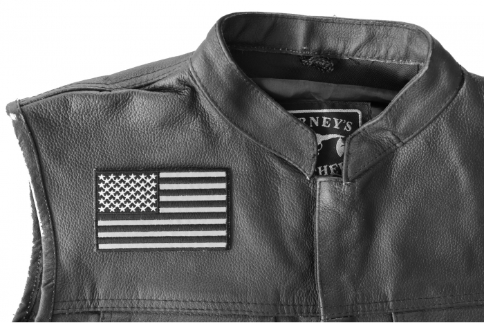 American Flag Black and Reflective 4 Inch Patch - 4x2.5 inch. Embroidered Iron on Patch shown on leather vest