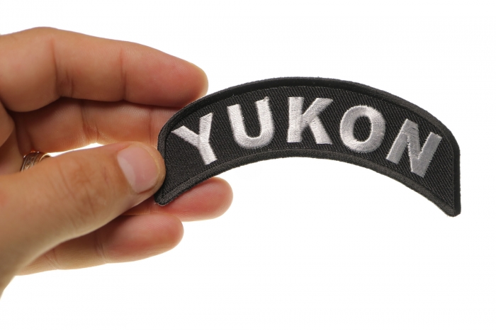 Yukon Patch Iron on State Rocker shown on hand for size comparison