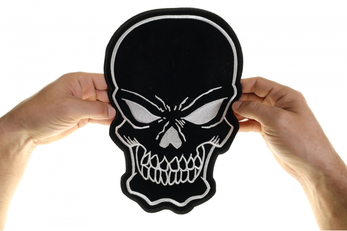 Black Skull Patch, Large Skull Patches for Biker Jackets shown on hand for size comparison