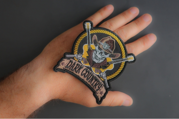 Dark Country Music Patch with Skull Cowboy Hat Guitars Pistols  shown on hand for size comparison