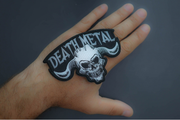 Death Metal Skull Patch shown on hand for size comparison