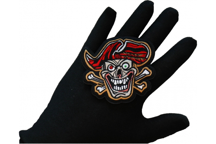 Deranged Jolly Roger Pirate Patch, Skull Patches shown on hand for size comparison