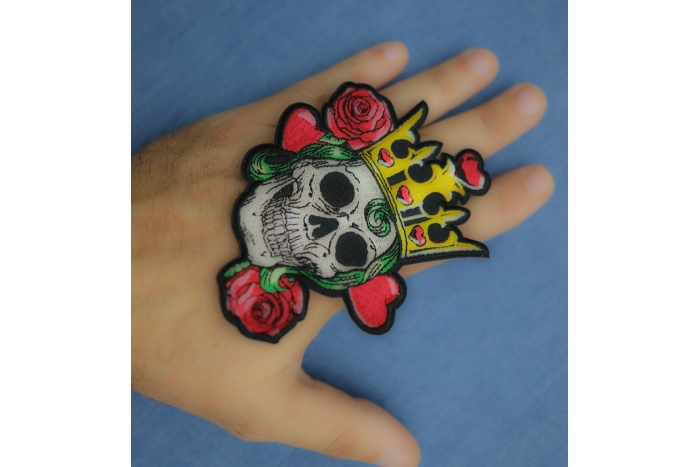 Hearts Queen Skull Patch shown on hand for size comparison