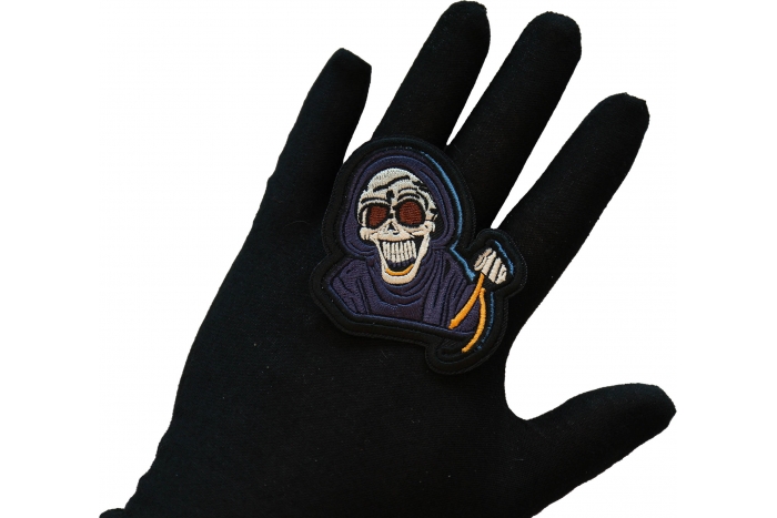 Laughing Reaper Patch, Skull Patches shown on hand for size comparison