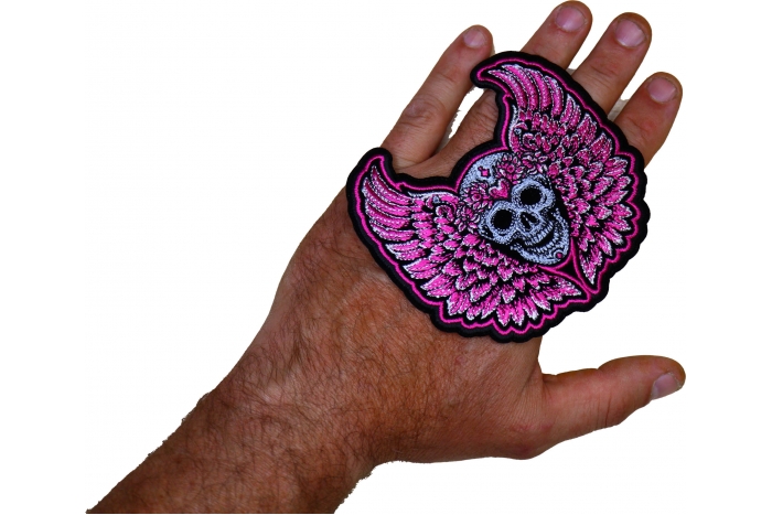 Pink Angel Wings Skull Patch shown on hand for size comparison