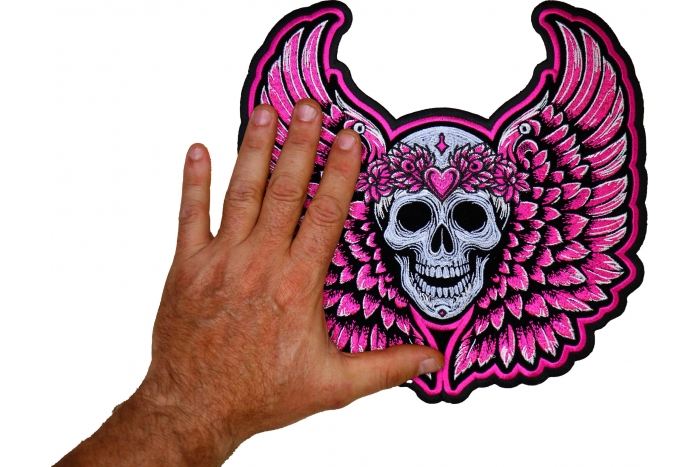 Pink Angel Wings Skull Patch shown on hand for size comparison