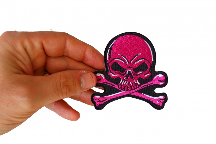 Pink Skull and Cross Bones Patch, Biker Skull Patches shown on hand for size comparison