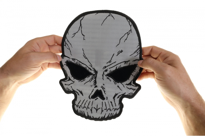 Reflective Skull Patch, Large Skull Patches for Biker Jackets shown on hand for size comparison