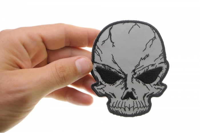 Reflective Skull Patch, Biker Skull Patches shown on hand for size comparison