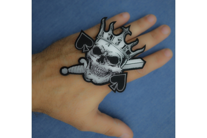 Spades Skull King Patch shown on hand for size comparison
