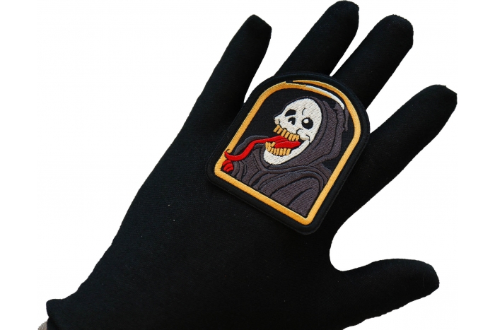 Tongue Reaper Patch, Skull Patches shown on hand for size comparison