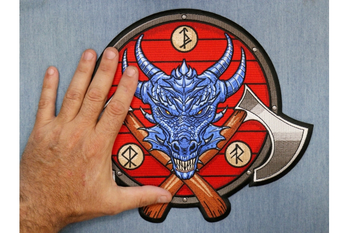 Viking Dragon and Axes Patch shown on hand for size comparison