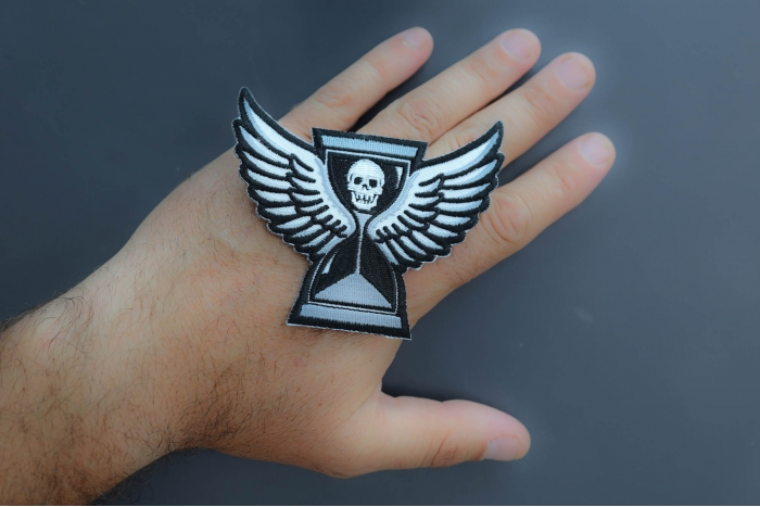 You are out of time pirate patch shown on hand for size comparison