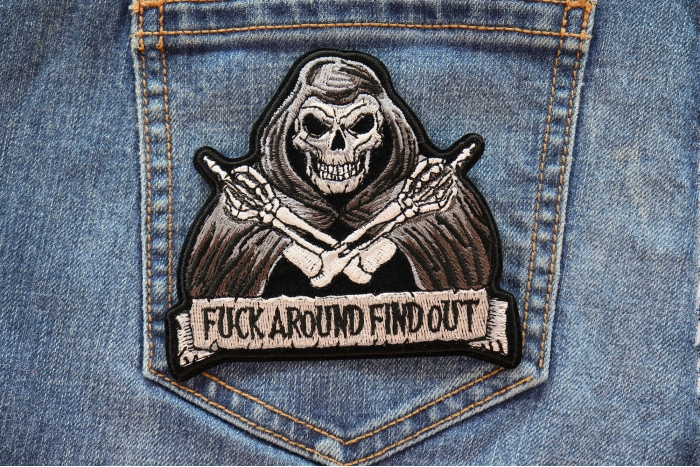 Fuck Around Find Out Skull Middle Finger Patch shown on jeans