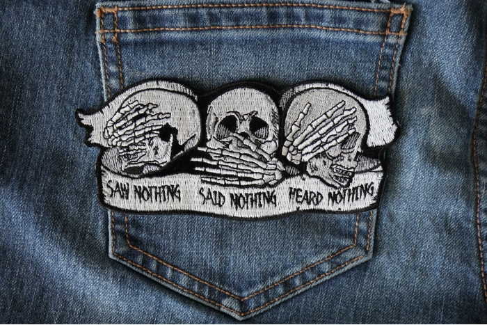 Heard Nothing Saw Nothing Said Nothing Skulls Patch shown on jeans