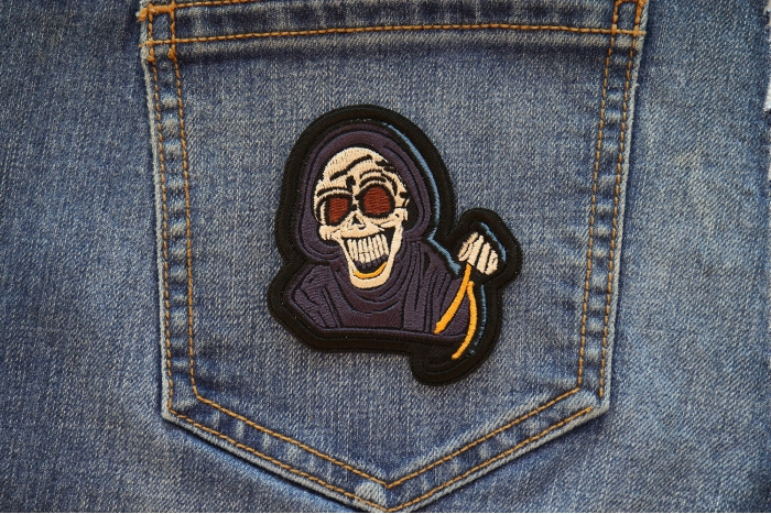 Laughing Reaper Patch shown on jeans