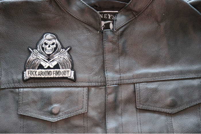 Fuck Around Find Out Skull Middle Finger Patch, Skull Patches shown on leather vest