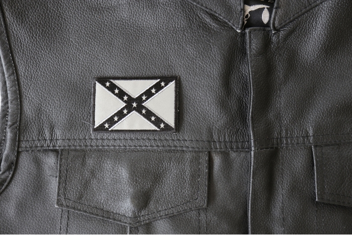 Reflective Rebel Flag Patch - 3x2 inch - Embroidered Iron on Patch shown on leather vest