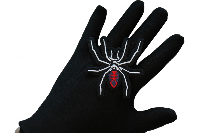 Arachnid Spider Iron on Patch shown on hand for size comparison