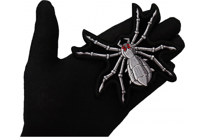 Mechanical Spider Patch shown on hand for size comparison
