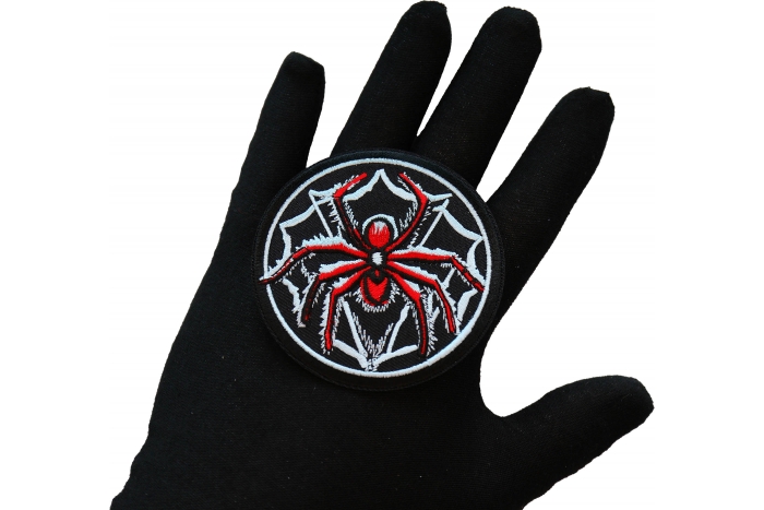 Spider Iron on Patch shown on hand for size comparison