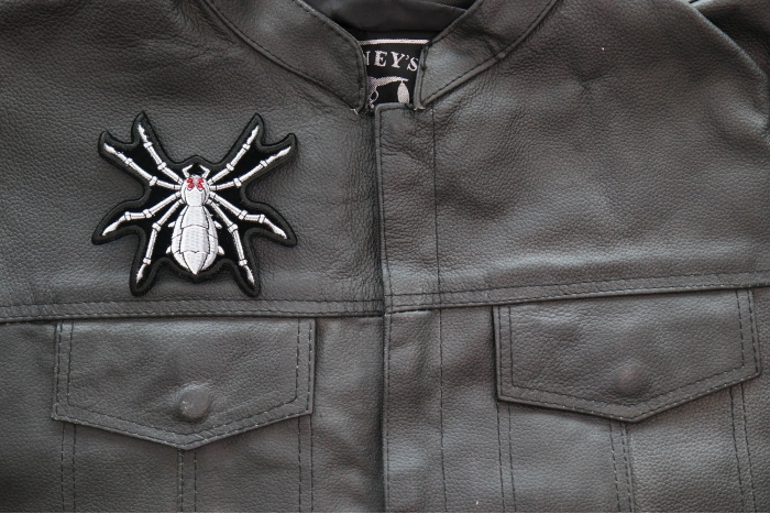 Mechanical Spider Patch shown on leather vest