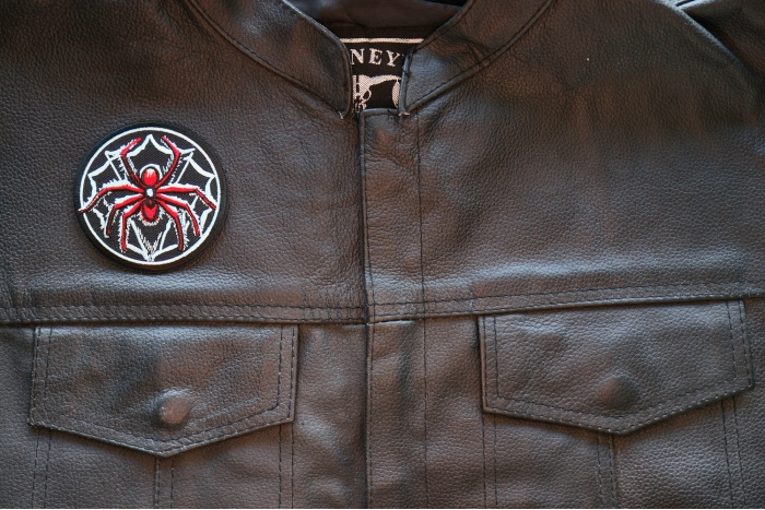Spider Iron on Patch shown on leather vest