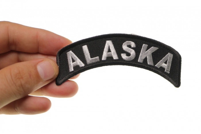 Alaska Patch Iron on State Rocker shown on hand for size comparison