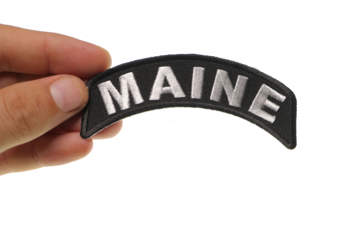 Maine Patch Iron on State Rocker shown on hand for size comparison