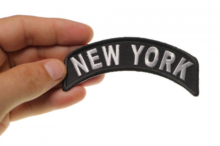 New York Patch Iron on State Rocker shown on hand for size comparison