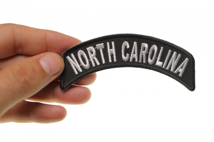 North Carolina Patch Iron on State Rocker shown on hand for size comparison
