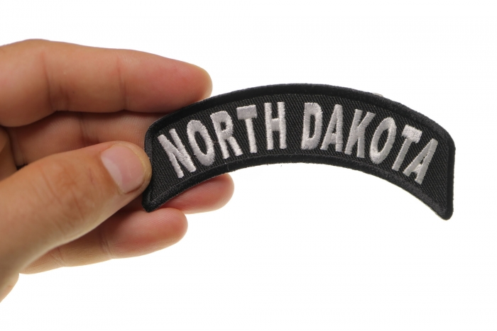 North Dakota Patch Iron on State Rocker shown on hand for size comparison