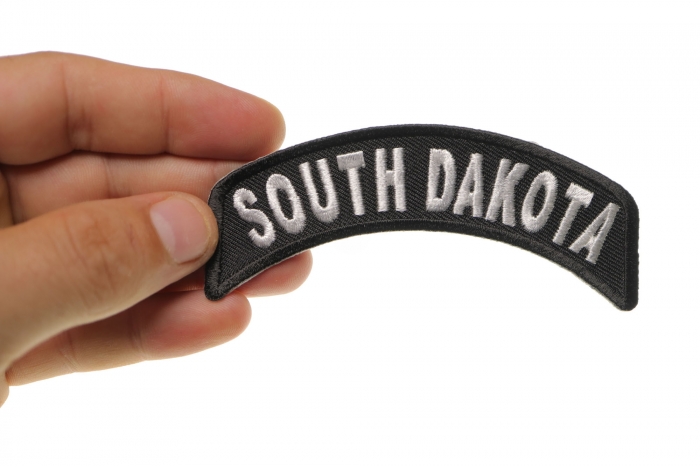 South Dakota Patch Iron on State Rocker shown on hand for size comparison