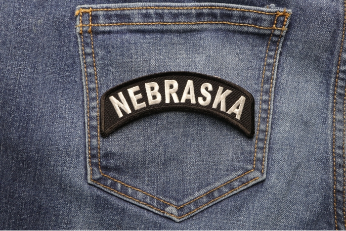 Nebraska Patch Iron on State Rocker shown on jeans