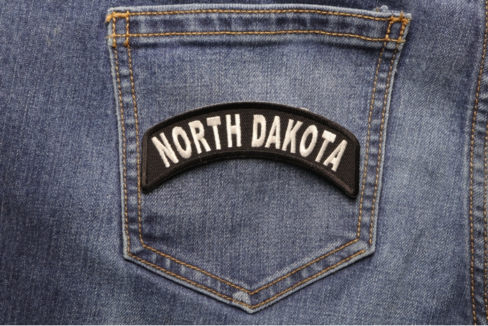 North Dakota Patch Iron on State Rocker shown on jeans