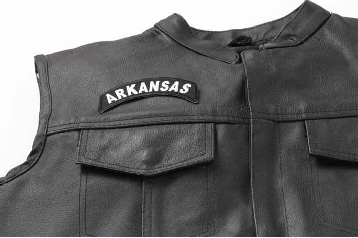 Arkansas Patch - 4x1.75 inch. Embroidered Iron on Patch shown on leather vest