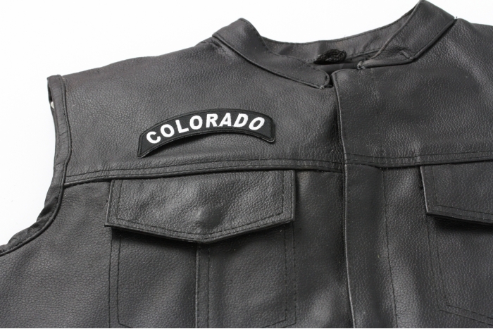 Colorado Patch - 4x1.75 inch. Embroidered Iron on Patch shown on leather vest