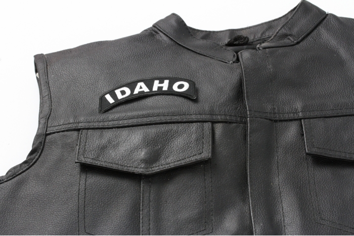 Idaho Patch - 4x1.75 inch. Embroidered Iron on Patch shown on leather vest