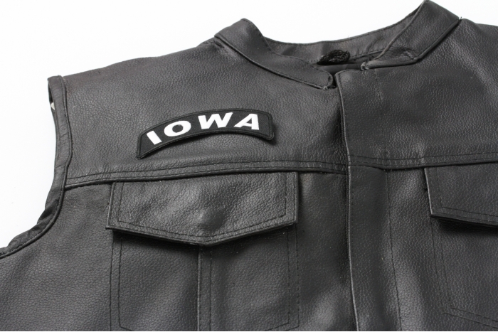 Iowa Patch - 4x1.75 inch. Embroidered Iron on Patch shown on leather vest