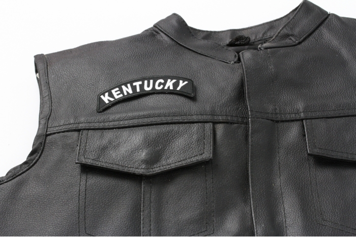 Kentucky Patch - 4x1.75 inch. Embroidered Iron on Patch shown on leather vest