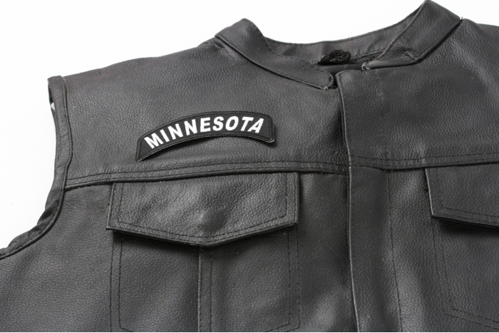 Minnesota Patch - 4x1.75 inch. Embroidered Iron on Patch shown on leather vest