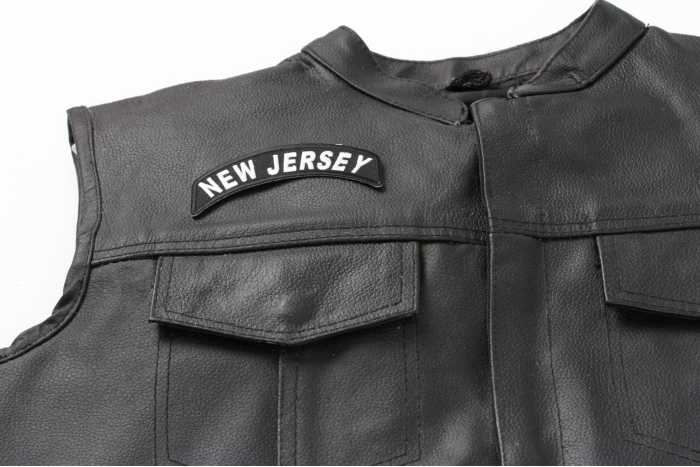 New Jersey Patch - 4x1.75 inch. Embroidered Iron on Patch shown on leather vest