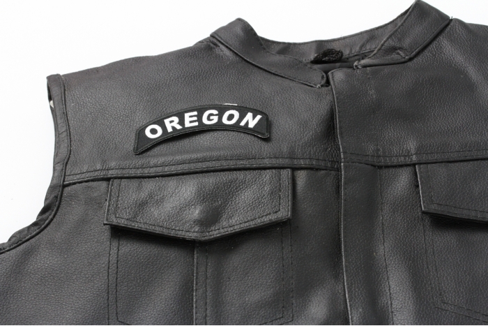 Oregon Patch - 4x1.75 inch. Embroidered Iron on Patch shown on leather vest