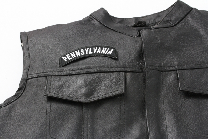 Pennsylvania Patch - 4x1.75 inch. Embroidered Iron on Patch shown on leather vest