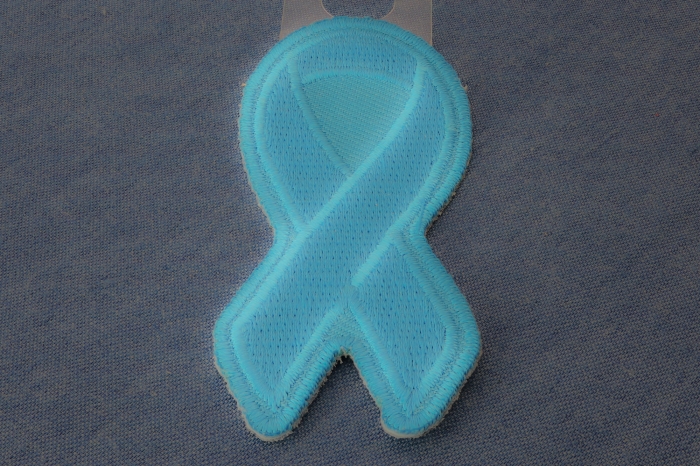 Blue Ribbon Patch For Awareness In Child Abuse and Bullying diagonal view