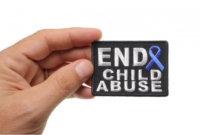 End Child Abuse Blue Ribbon Patch shown on hand for size comparison