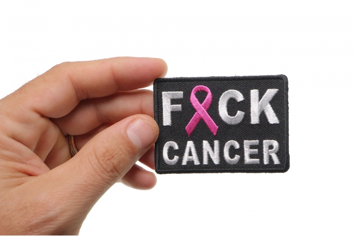 FCK Cancer Pink Ribbon Patch shown on hand for size comparison